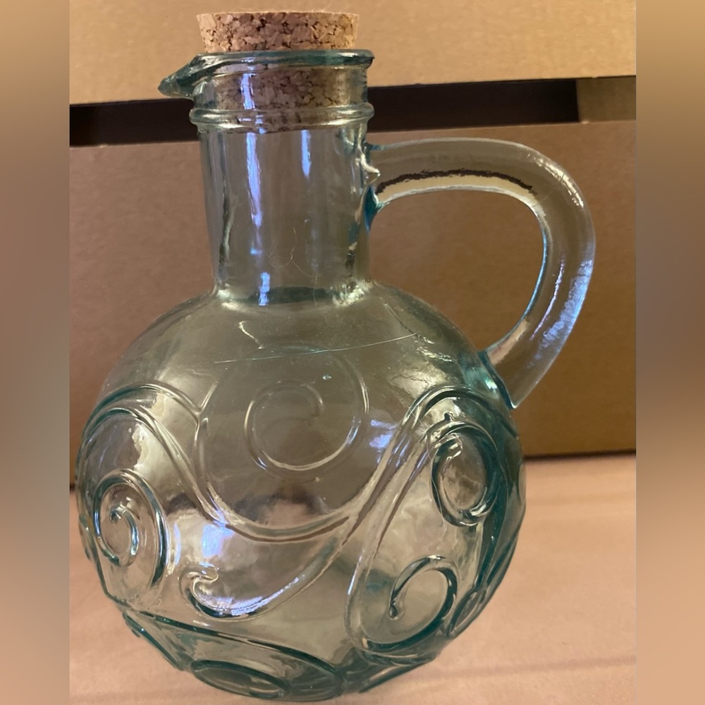 Glass ball style corked storage great for homemade dressings or herbs or grains